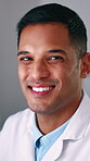 Face, science and man in laboratory for development of cure, pharmaceuticals or vaccine. Medical, research and smile with confident scientist at work in healthcare facility for clinical trial