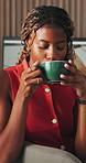 Woman, relax and drinking coffee in home with thinking, morning routine and delicious taste for wellness. Calm, black person and reflection in living room with tea cup, daydream and hot beverage.
