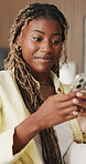Black woman, phone and happy with typing on home sofa for communication, internet and online dating. Female person, technology and connection to browse on social media app in living room on couch