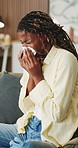 Woman, sneeze or blowing nose in apartment with tissue, health problem or flu symptoms from burnout. Sick, black person and allergy in home with toilet paper, virus or congestion from sinus infection