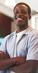 Portrait, arms crossed and business black man in office for about us, branding manager and professional. Confidence, creative director and happy with employee in media agency for opportunity