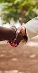 Closeup, handshake and business people in city, agreement for b2b deal and contract. Outdoor, employee and consultant in street, shaking hands and collaboration for project, greeting and partnership