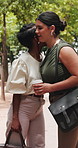 Happy women, hug or business with greeting in park for commute, travel or goodbye together. Female people, employee or colleagues with wave or outdoor farewell for work trip, completion or respect