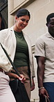Happy, business people and walking with team in city for travel, work trip or outdoor commute. Group, employees or colleagues with smile or bags on staircase for break or done with job in urban town