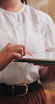 Tablet, scrolling and hands of businesswoman in office with research, communication or email. Reading, planning and female employee with digital technology for networking, contact or review on app.