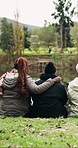 Outdoor, camping and friends with hug for break, eco tourism and sightseeing for winter holiday. Relax, bonding vacation and people pointing by lake for view, back and support for weekend travel