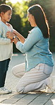 Mother, dressing and child outdoor for back to school, preparation and morning routine. Woman, helping or daughter for outfit change, getting ready and neat appearance with encouragement for learning