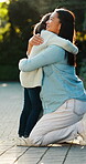 Outdoor, mother and child with hug for support, happiness and family connection for weekend bonding. Smile, woman and girl with embrace for security, trust and comfort for healthy relationship.
