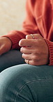 Anxiety, hands and woman on sofa in home with nervous, mental health or stress in living room. Frustration, overthinking and female person with worry for decision, choice or trauma in apartment.