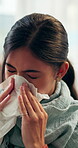 Sick, sneezing and woman in home with tissue, influenza and cold congestion in allergy season. Health, virus and person in house with paper napkin, blowing nose and viral flu in wellness risk.