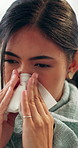 Sick, sneeze and woman in house with tissue, influenza and cold congestion in allergy season. Health, virus and person in home with paper napkin, blowing nose and viral flu in wellness risk.