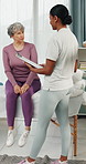 Physio, clipboard and elderly woman in clinic with discussion, survey and rehabilitation feedback. Senior person, healthcare worker and talk with checklist, physical therapy and medical questions.