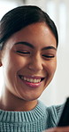 Woman, phone and relax with laugh in home with smile, funny meme and post on web in living room. Girl, smartphone and typing in lounge with mobile app, online dating and social media at apartment