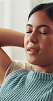 Relax, peace and woman on sofa in home for self care, calm or breathing in living room on weekend. Smile, mindfulness and female person on couch for wellness, health and comfortable break in house.
