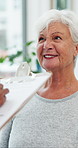 Talking, sick and old woman in hospital, clipboard for symptoms and healthcare info. Pensioner, wellness and senior patient in clinic, documents and checklist for insurance, retirement and assessment