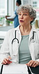 Doctor, woman and discussion with documents at hospital, happy or questions for medical report. Mature person, healthcare professional and smile with wellness, checklist and consultation at clinic