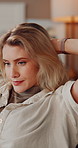Thinking, girl and relax with stretching on sofa for weekend break, stress relief or peaceful moment. Comfort, woman and tired exhale in home with reflection, cozy rest and satisfaction for me time