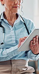 Doctor, woman and hands with tablet for healthcare, medical support or schedule for treatment. Digital tech, mature professional and report in clinic for cardiology, wellness or online for telehealth