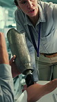 Lab, robotics and people with prosthetic leg for research, development and design feedback. Science, collaboration and man with woman with artificial limb for medical innovation, model and solution