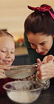 Happy mom, child and sift with flour in kitchen for baking recipe or ingredients together in home. Mother, daughter and learning with junior baker or bowl for christmas cookies or dessert in house
