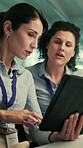 Tablet, meeting and business women in office with research for AI development project. Digital technology, discussion and team of female engineers with planning for computing assignment in workplace.