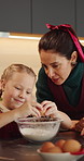 Happy mom, child and teaching with egg in kitchen for baking recipe or ingredients together in home. Mother, daughter and learning with junior baker or bowl for christmas cookies or dessert in house