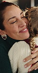 Christmas, mom and child in house with gift giving, box surprise and bonding together in xmas celebration. Bokeh, woman and kid in home with hug, present gratitude and connection in festive season.