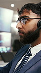 Businessman, broker and consultant with headset for stock market analysis or online trading in office. Man, financial advisor or agent monitoring with mic for digital currency or virtual assistance