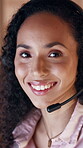 Call center, face and woman in office with headset, contact us or crm service in evening. Happiness, night and consultant in agency with mic, online assistance or customer support in overtime.