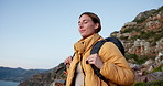 Smile, woman and hiking with breathing on mountain for travel, adventure and fresh air. Space, female person and inhale with reflection, backpacking view and trekking fitness for sightseeing nature