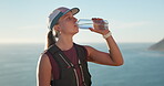 Ocean, fitness and woman with water, resting or athlete in hydration vest on break and mockup space. Outdoor, runner and person with sustainable bottle after workout, health or drinking liquid by sea