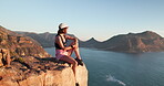 Hiking, thinking and woman with break on mountain peak, outdoor expedition rest and view ocean scenery. Reflection,  and person relax on cliff for peace, trekking and daydream for holiday