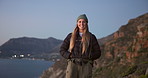 Face, woman and hiking with smile on mountain for travel, adventure and fitness activity. Portrait, female person and happy for backpacking, trekking hobby and evening with fresh air on getaway trip