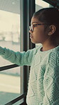 Glasses, reflection and sad with child at window in home for memory, abandoned and foster trauma. Grief, thinking and separation anxiety with girl in apartment for worry, fear and psychology crisis