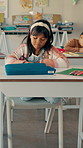 School, thinking and girl in classroom for writing, education and creative lesson for child development. Academy, youth and kids with stationery for learning, studying and drawing in notebook at desk