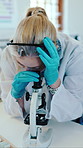 Science, microscope or woman in laboratory for learning, virus research or analysis in class. Microbiology, equipment or girl in college for education, virology or medical study with help of lecturer