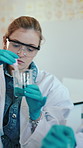 University, chemistry and women with beaker for sample, experiment and research project. Students, microbiology and education with dropper, classroom and laboratory for scholarship and pathology
