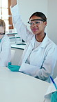 Science, question and student with raised hand in college for learning, knowledge or development. University, lecture and happy girl with answer in chemistry class, medical research or education