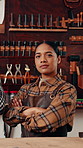 Face, arms crossed or leather artisan in warehouse with pride, ambition or career in goods manufacturing. Portrait, woman or craftsperson with confidence, about us or textile industry in Australia.