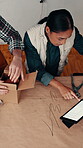 Box, tablet and people packing for delivery, shipping and ecommerce in leather workshop. Above, package and stock in small business for logistics, distribution and online order with digital tech