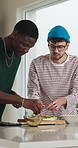 Cooking, ingredients and friends with pizza in kitchen for dinner, lunch and meal prep together. Home, prepare and men with vegetables for nutrition, wellness and help with supper for social hangout