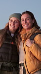 Backpacking, hug and face of girl friends in nature with bonding, love and connection together on holiday. Smile, hike and portrait of women outdoor with embracing for travel, vacation or weekend.