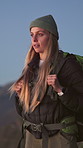 Breathing, backpacking and woman on mountain in nature hiking, adventure or fitness on holiday. Travel, journey and female person trekking for exercise, hobby or health on vacation or weekend trip.