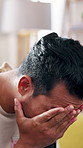 Thinking, anxiety and man with stress in home for mistake, overthinking and worry for future. Apartment, depression and person with regret, frustrated and emotional for pressure, tension and doubt