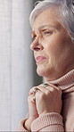 Sad, thinking and senior woman in home, anxiety and mourning for grief, remember or contemplation. Reflection, stress and person with depression, mental health or retirement with emotion and wonder