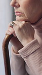 Walking stick, hands and senior woman in home, anxiety and mourning for grief, sad or contemplation. Remember, stress or person with depression, alzheimer or retirement with memory, lonely or emotion