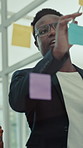 Creative, people and brainstorming at glass wall with sticky note, planning or discussion for marketing. Team, meeting and conversation in office with strategy, idea or collaboration for advertising.