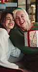 Christmas, gift and women in home, hug and celebration for festive season, relax and love, Smile, family and mature mother in lounge, present for Xmas and happiness for tradition, embrace and excited