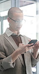 Phone, smile and businesswoman in office with communication, email or networking on mobile app. Professional, technology and female creative editor with cellphone for contact in workplace with flare.