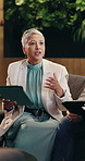 Woman, tablet and meeting in lounge at office for discussion, insight or review at insurance company. Mature broker, tech and team with planning, collaboration or feedback at risk management agency